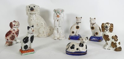 Lot 163 - A group of eight Staffordshire pottery figures,...