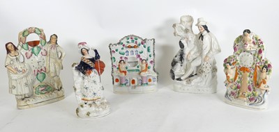 Lot 164 - A group of five Staffordshire pottery figures,...