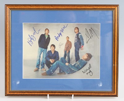 Lot 1278 - Oasis, an 18 x 25cm colour image of the band...