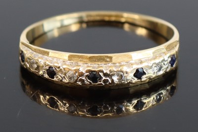 Lot 301 - A 9ct gold sapphire and diamond half eternity...