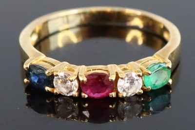 Lot 311 - A yellow metal multi-stone half hoop ring, set...