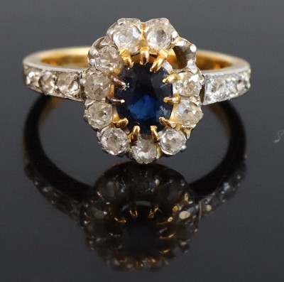 Lot 312 - A yellow metal sapphire and diamond cluster...