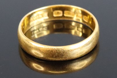 Lot 316 - A 22ct gold court shaped wedding band, sponsor...