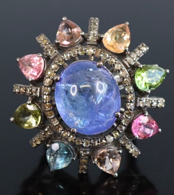 Lot 321 - A large silver cluster ring, set with a...