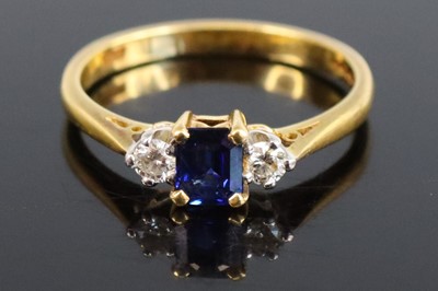 Lot 326 - An 18ct gold sapphire and diamond three-stone...