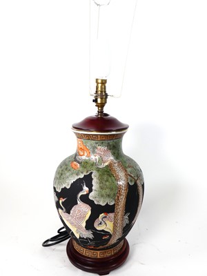 Lot 13 - A Japanese porcelain table lamp, decorated...
