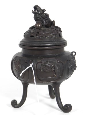 Lot 167 - A Japanese bronze koro, the reticulated cover...