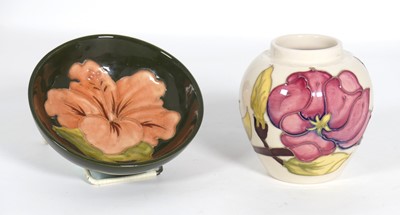 Lot 168 - A Moorcroft Hibiscus pattern pottery footed...