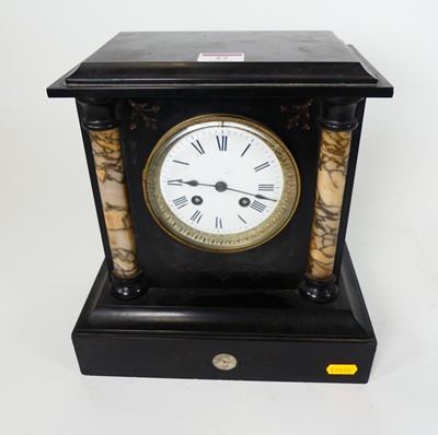 Lot 27 - A late 19th century black slate mantel clock...