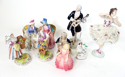 Lot 37 - A collection of porcelain figures, to include...
