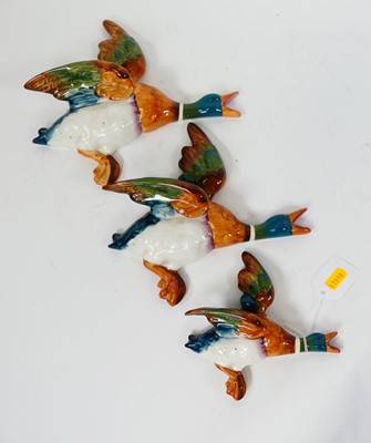 Lot 38 - A graduated set of three Beswick duck wall...