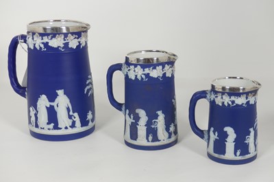 Lot 187 - A graduated set of three Wedgwood blue...