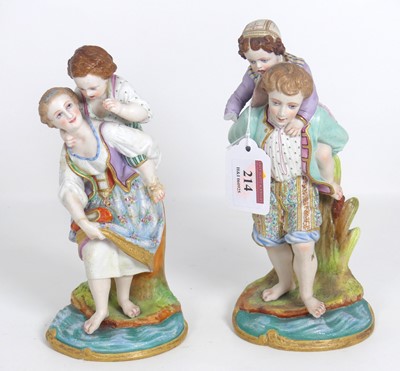 Lot 214 - A pair of bisque porcelain figures of a boy...