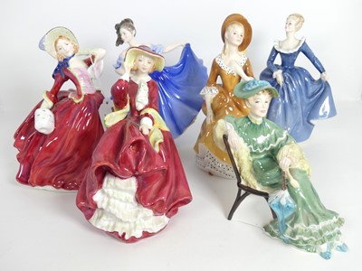 Lot 218 - A group of six Royal Doulton figures of ladies,...