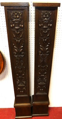 Lot 1111 - A pair of floral relief carved oak interior...