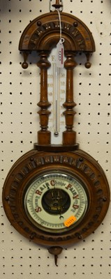 Lot 1115 - An early 20th century walnut aneroid two-dial...