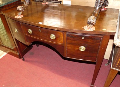 Lot 1228 - A 19th century mahogany kneehole bowfront...
