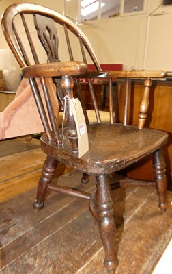 Lot 1238 - A 19th century elm child's splatback Windsor...