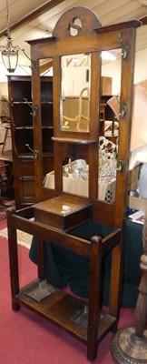 Lot 1169 - An Edwardian oak mirrorback hall stand, w.79cm