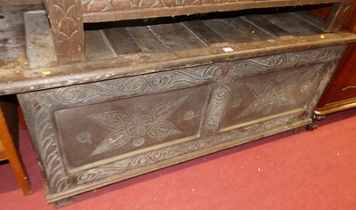Lot 1240 - An antique joined oak and later floral line...