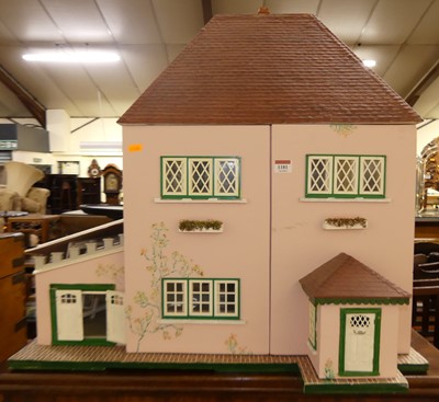 Lot 1181 - A painted two-storey dolls house