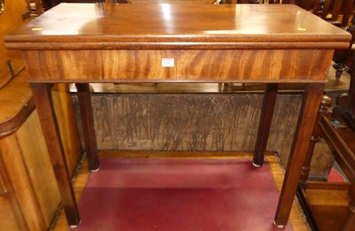 Lot 1182 - A George III mahogany fold-over tea table,...