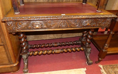 Lot 1183 - A circa 1900 heavily carved oak two drawer...