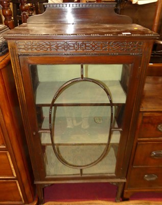 Lot 1192 - An Edwardian walnut ledgeback single door...