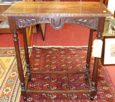 Lot 1195 - An early 20th century floral relief carved oak...