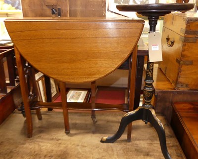 Lot 1213 - A lacquered and gilt decorated circular...