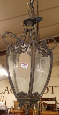 Lot 1271 - A pair of floral decorated cast metal hanging...