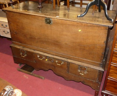 Lot 1214 - An antique elm and oak hinge topped mule chest,...