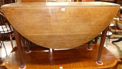 Lot 1222 - A circa 1800 oak dropflap dining table, w.116cm