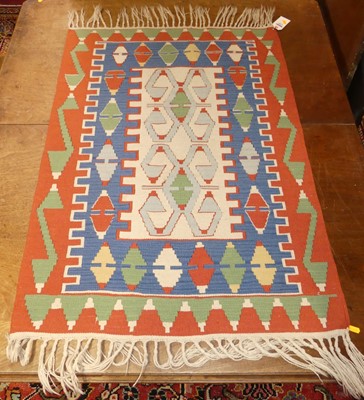 Lot 1280 - A Turkish woollen multi coloured kilim rug,...