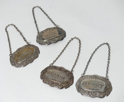 Lot 244 - A matched set of four repousse decorated...