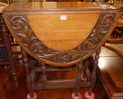 Lot 1289 - An early 20th century floral relief carved oak...