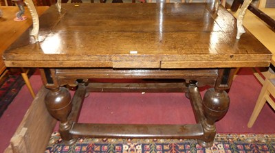 Lot 1310 - An antique and later joined oak draw-leaf...