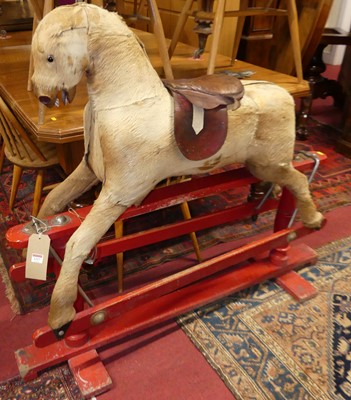 Lot 1317 - A vintage child's rocking horse, having a tan...