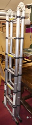 Lot 1318 - A contemporary brushed tubular aluminium...