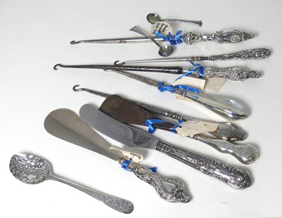 Lot 281 - A collection of silver handled button hooks...
