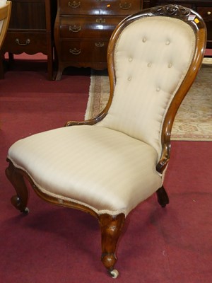 Lot 1332 - A mid-Victorian walnut framed and cream stripe...