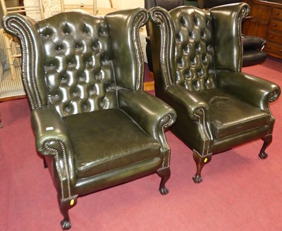 Lot 1343 - A pair of contemporary green leather...