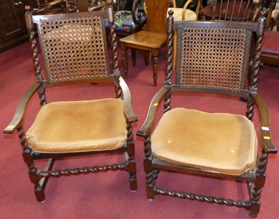 Lot 1351 - Two similar early 20th century walnut cane...