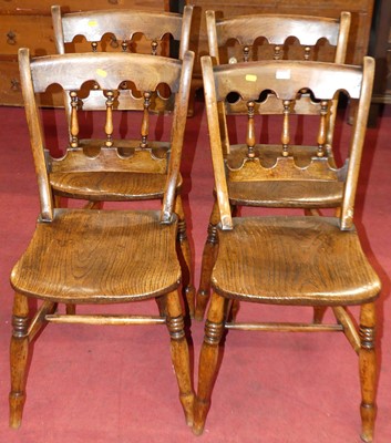 Lot 1352 - A set of four circa 1900 elm and beech spindle...