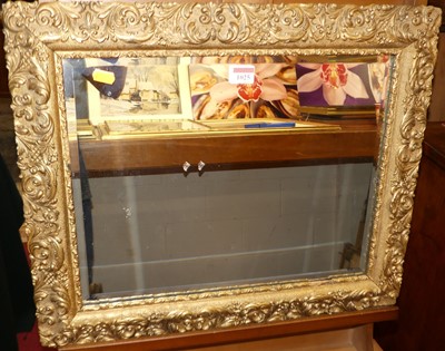 Lot 1025 - A gilt composition framed and bevelled...