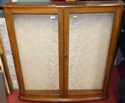 Lot 1049 - A glazed walnut hanging wall cabinet, 20th...
