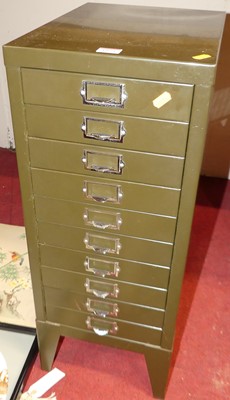 Lot 1053 - A flight of ten metal filing drawers, width 29cm