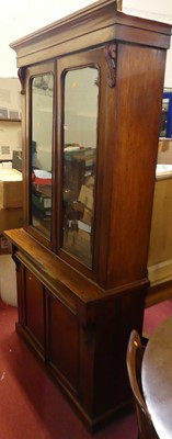 Lot 1394 - A mid-Victorian mahogany bookcase cupboard,...