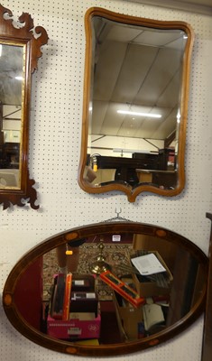 Lot 1395 - A figured walnut framed oval wall mirror, 61 x...