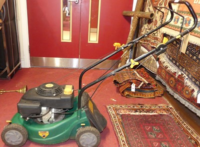 Lot 1150 - A petrol driven lawn mower, with grass...